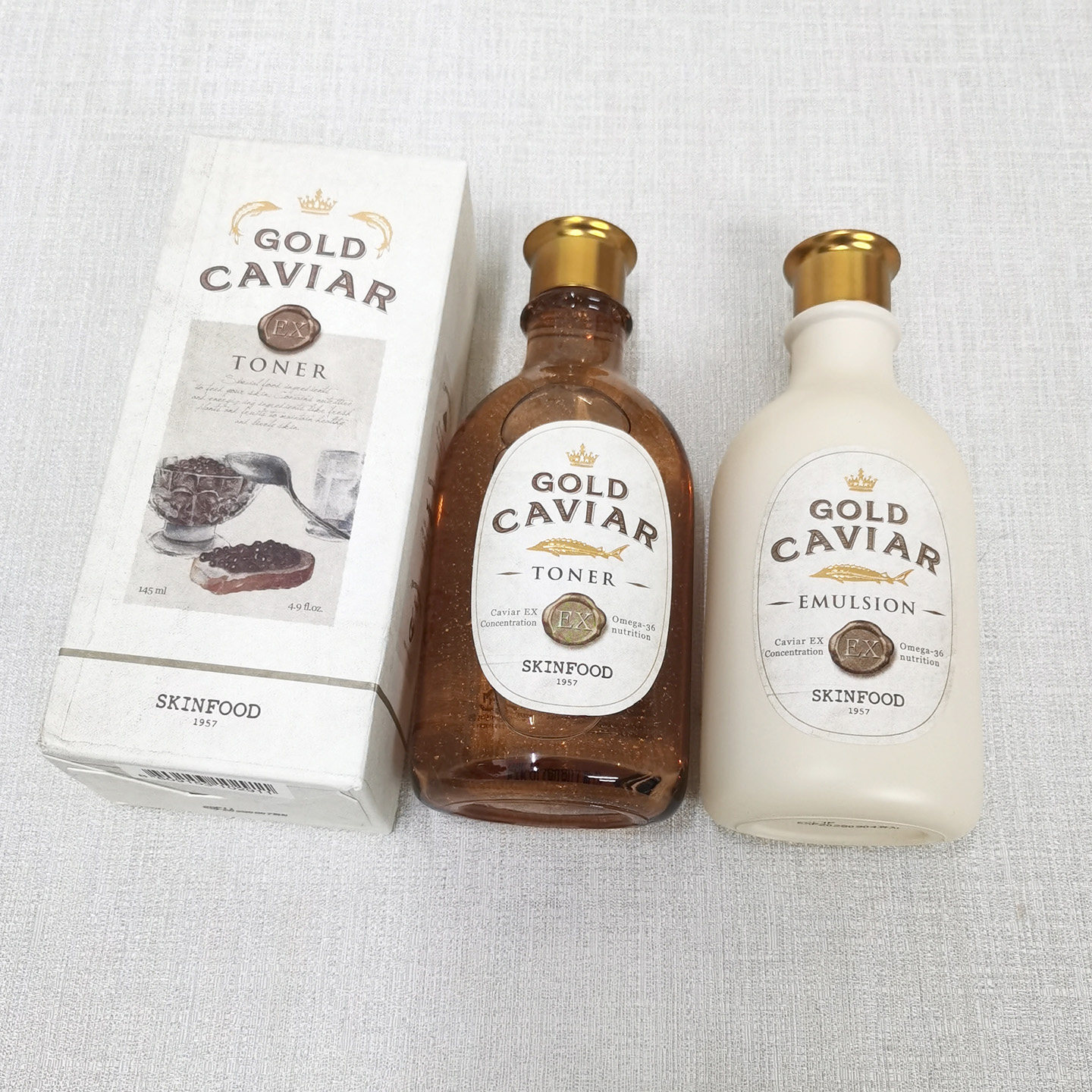 包邮思亲肤鱼子酱水乳液面霜眼霜精华套装补水保湿紧致skin food