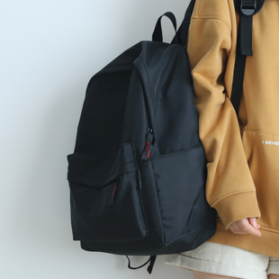 黑色简约百搭双肩包男书包初中女生轻便旅游登山包纯色双肩背包