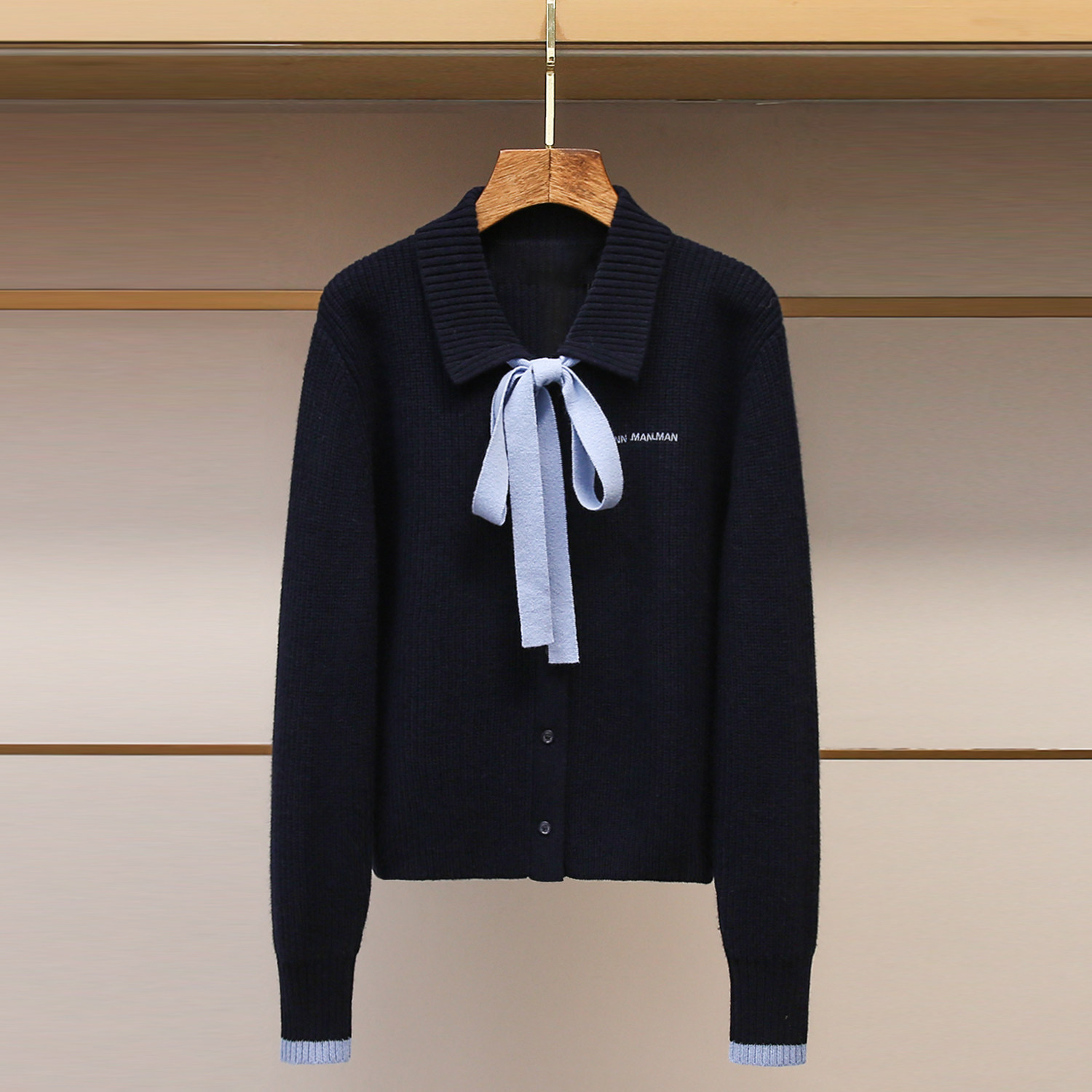 深圳南油高端女装2025冬季新款修身翻领系带撞色毛织开衫毛衣外套