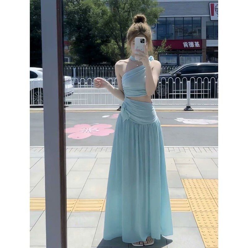 超仙性感斜肩法式茶歇连衣裙镂空露腰宽松显瘦压褶气质风无袖长裙