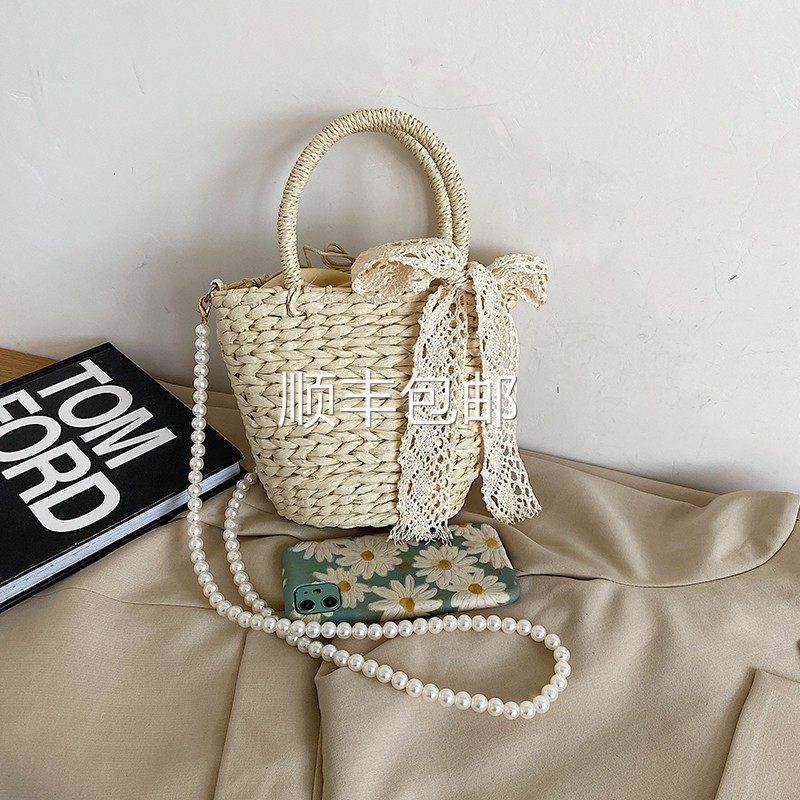 全球仙网红包珍珠链条女包女2026夏季新款时小尚草编包手提水桶斜