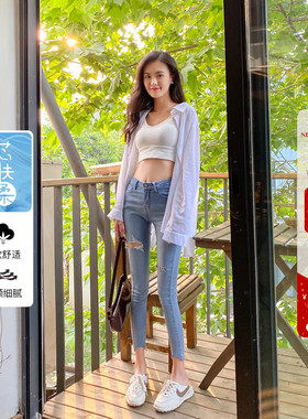 巨显瘦冬季加绒浅蓝色高腰破洞小脚牛仔裤女修身显瘦九分铅笔裤子