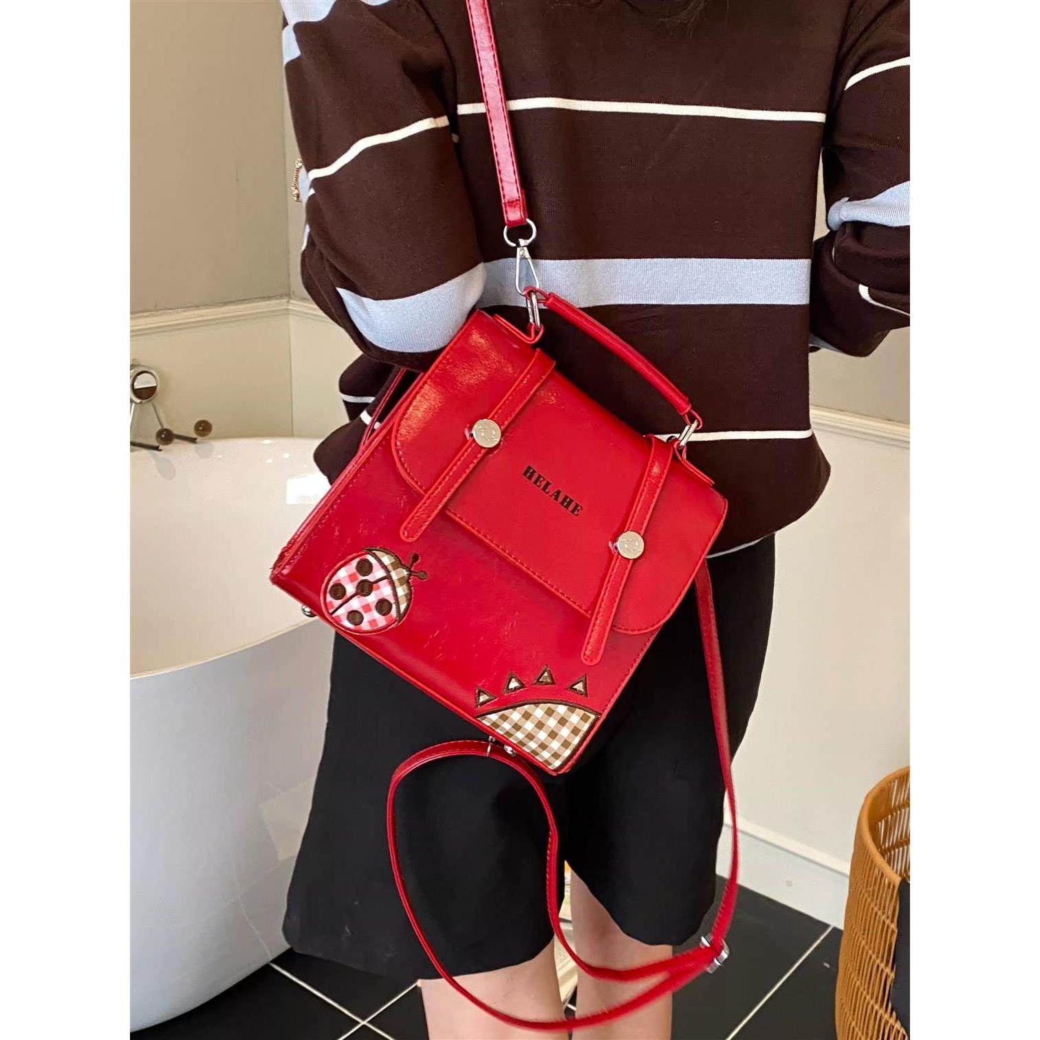 红色双肩包女2026新款大容量可爱学院风通勤包书包韩系斜挎通勤包