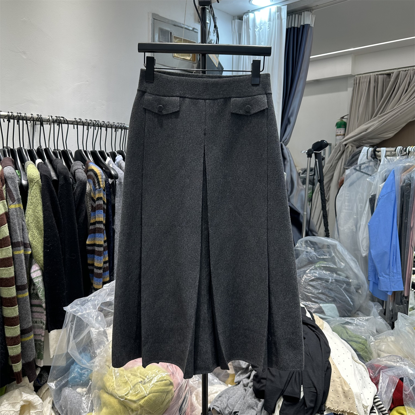 欧洲站2025冬季新款时尚慵懒风假口袋压褶针织羊毛裙A字半身裙女