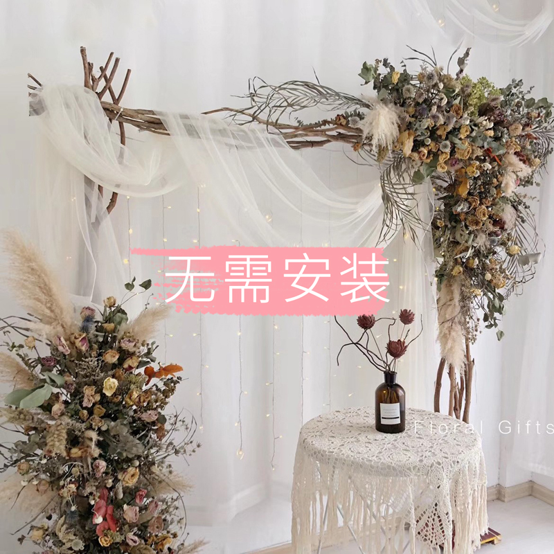 森系树枝花艺木架婚庆拱门景布置