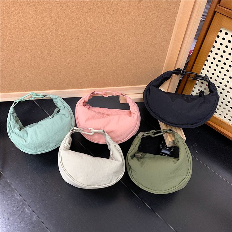 日单饺子包2025新款文艺休闲风尼龙帆布手机包斜挎包腋下包单肩包