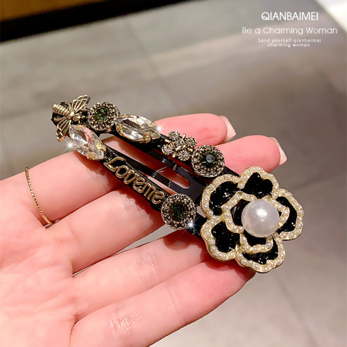 侧边山茶花刘海夹水晶优雅