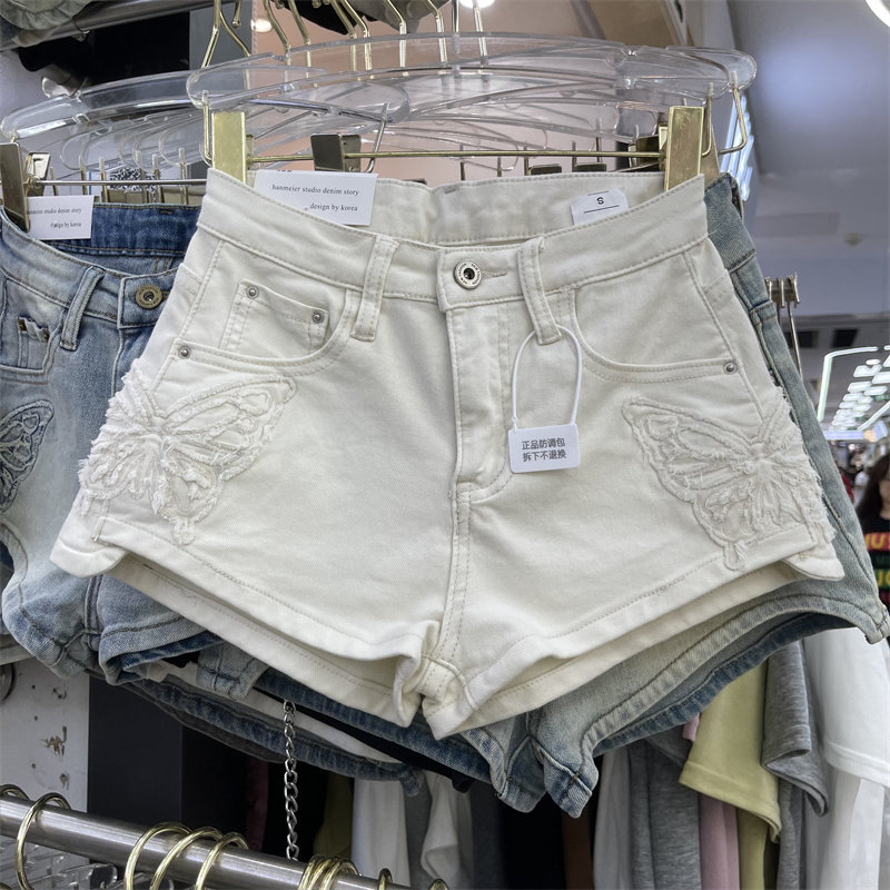 设计感蝴蝶白色牛仔短裤女2025夏季新款显瘦性感辣妹包臀a字热裤,女装/女士精品,牛仔裤,淘宝优惠券,粉丝福利购,淘宝优惠卷