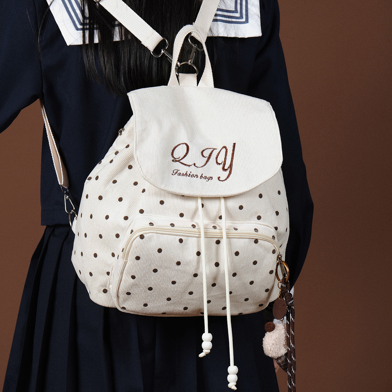 2025新款韩版波点双肩包女学院风复古灯芯绒抽绳小背包青少年书包