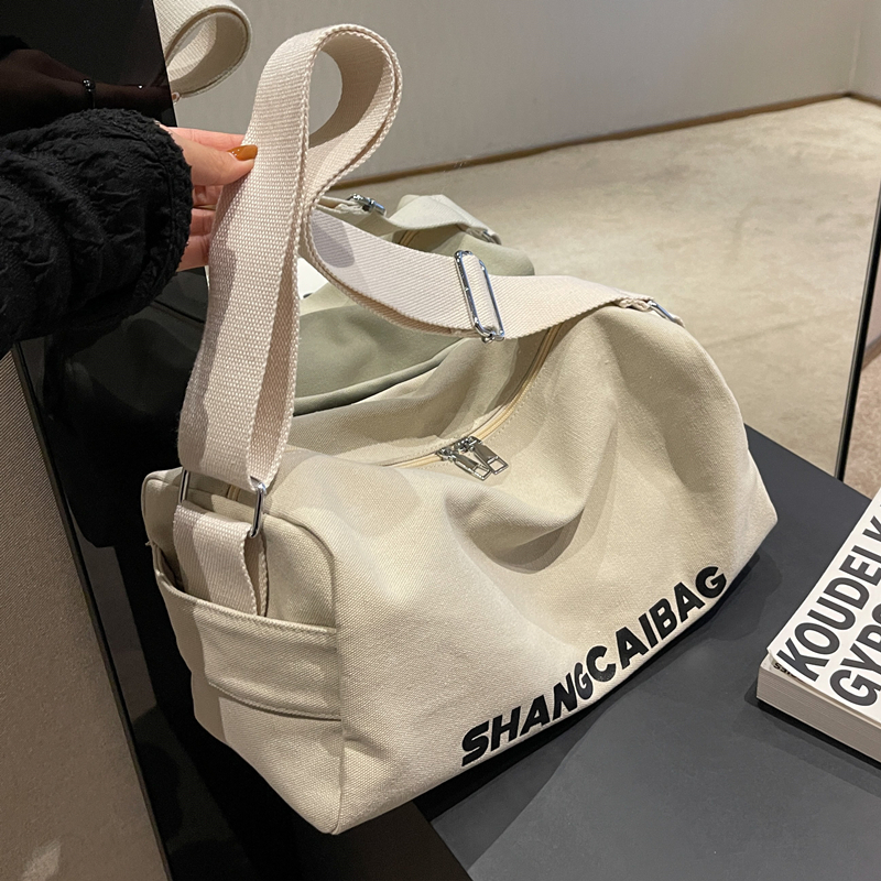 大容量帆布包包女休闲运动单肩圆筒枕头包小众ins百搭宽带斜挎包