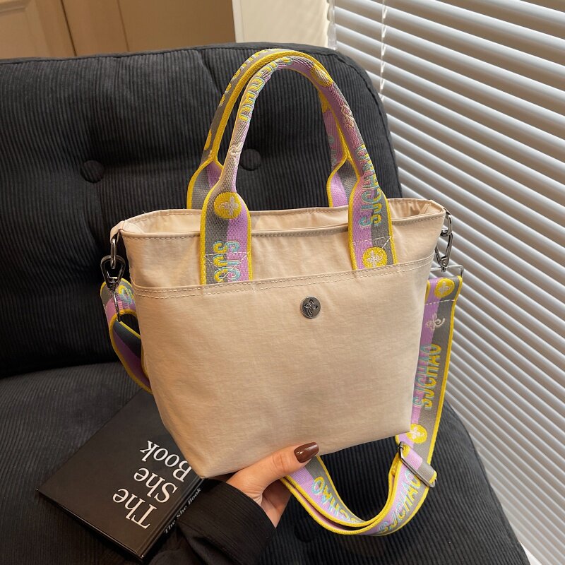 夏季小众尼龙包包女式2025新款时尚手提水桶包百搭单肩斜挎通勤包