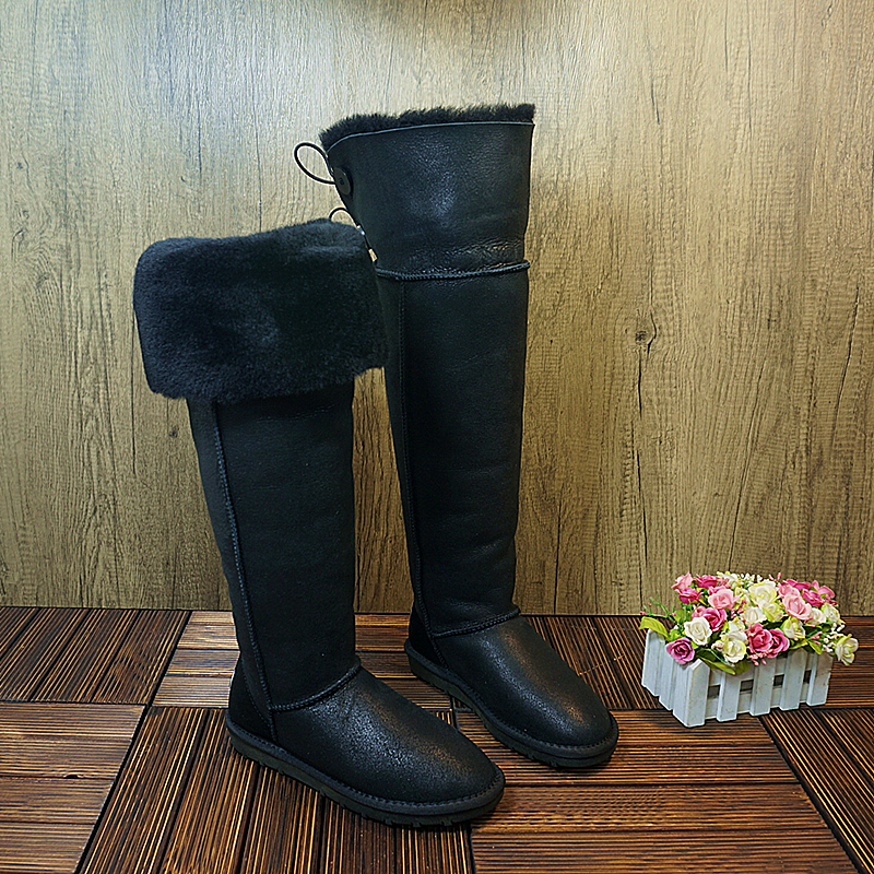 冬季真皮羊毛一体扣子防滑高筒靴