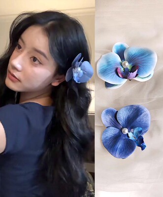 明媚少女头戴花花发饰蝴蝶兰发夹