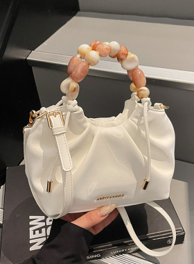 艾米兔女包2026新款日常休闲纯色小众简约手提串珠包洋气斜挎包