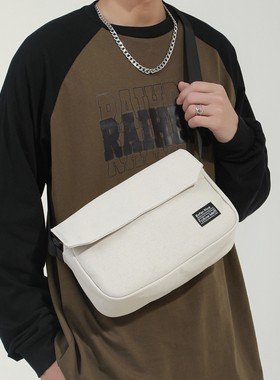 男生斜挎包小包潮休闲学生帆布包男款邮差包通勤单肩包男士小挎包