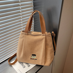 带拉链加厚帆布托特包包女卡通刺绣手提通勤包百搭简约风小水桶包