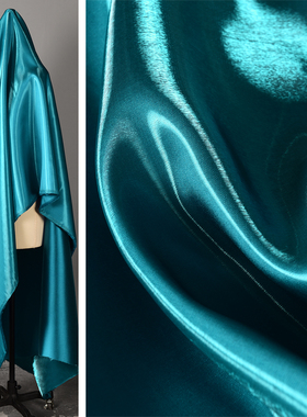 超亮反光液态水晶缎面料-厚款 孔雀蓝色丝滑琉璃感连衣裙礼服布料