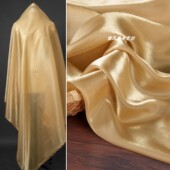 饰丝绸光泽薄纱布料 百合缎丝滑礼服连衣裙背景装 金色 水光纱面料