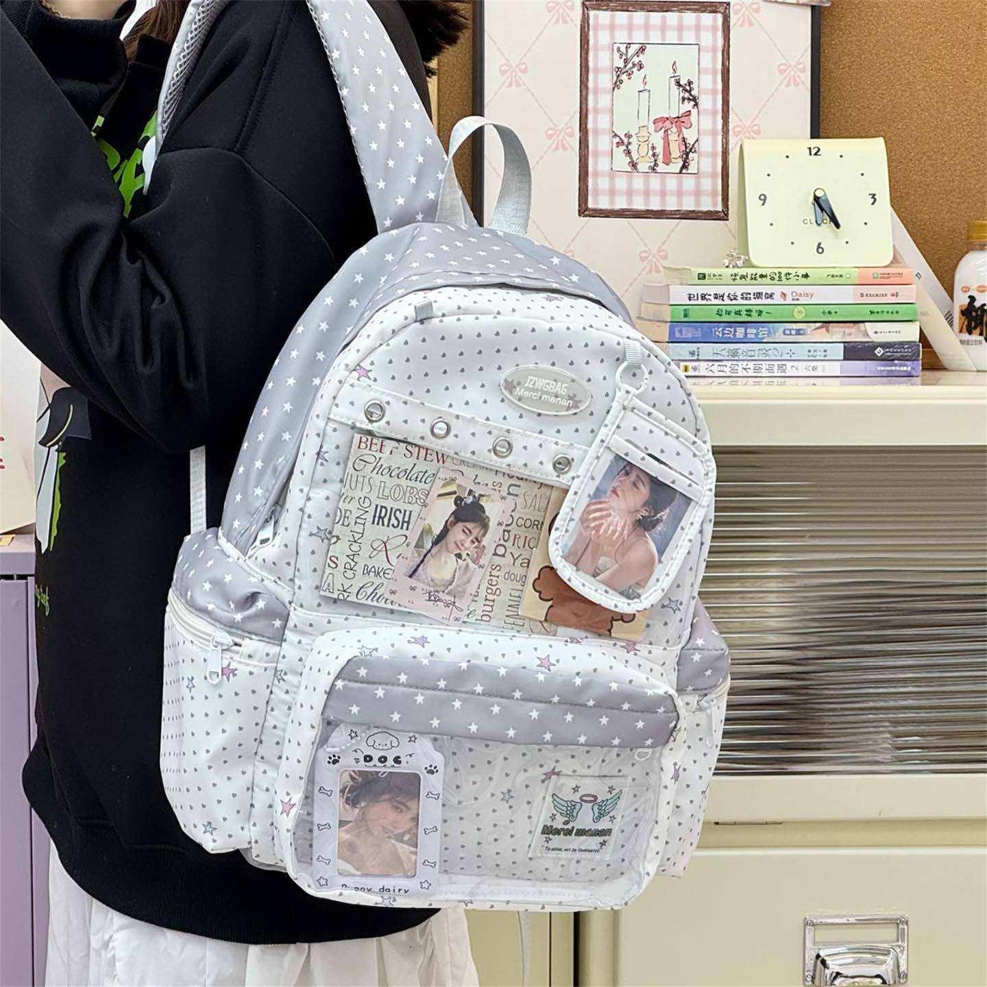 设计感波点痛包星星印花双肩包小学生书包女童初中生高中旅游背包