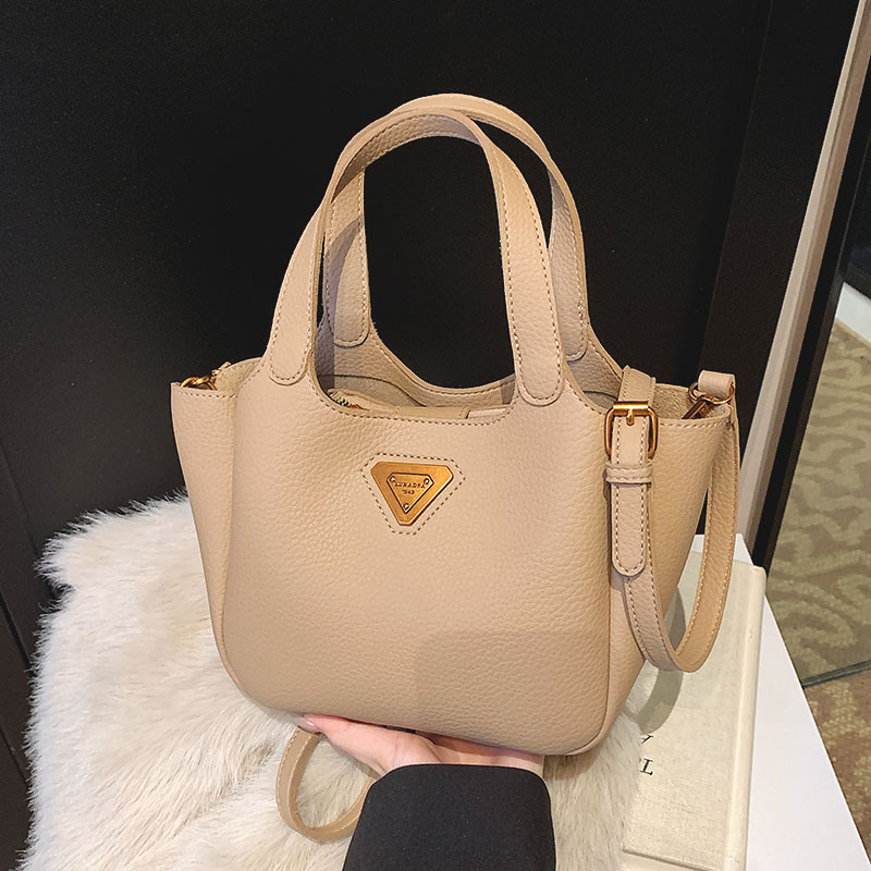 菇八八休闲爆款手提水桶包