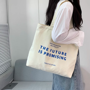 帆布包女带拉链单肩2025新款慵懒风小众大容量学生上课通勤装书包