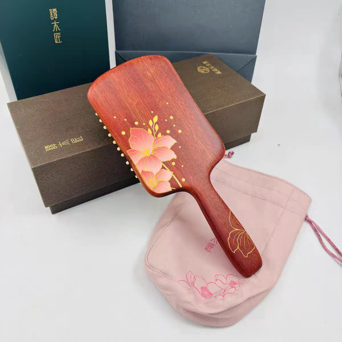 谭木匠正品礼盒气垫护发梳紫荆花开天然气囊按摩经络女士专用