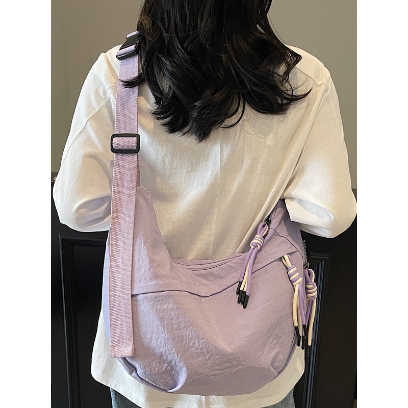 法国简约大容量斜挎包女2025新款学生糖果色单肩帆布百搭饺子包女