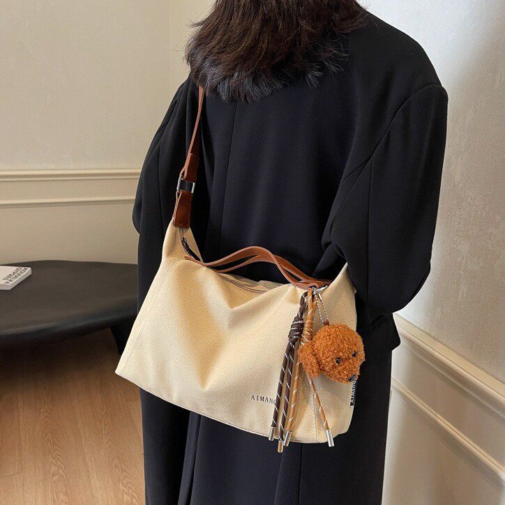 休闲斜挎帆布包包女2026夏季新款大容量百搭托特包简约通勤单肩包