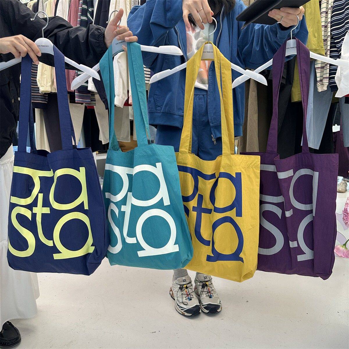 韩系简约新款字母大容量单肩包休闲日常时尚流行手提单肩包通勤包