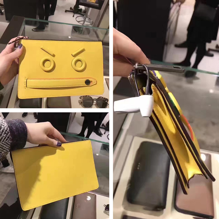 FENDI·ÒµÏ ÐÂ¿î»ÆÉ«ÄÐÊ¿¸¡µñ±íÇéÀóÖ¦ÎÆÊÖ²å°ü»ÆÉ«ÊÖÄðüÄаüÊÖ°ü