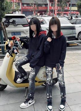 2025高版本新款黑色泼墨涂鸦破洞牛仔裤男女百搭休闲修身弹力小脚