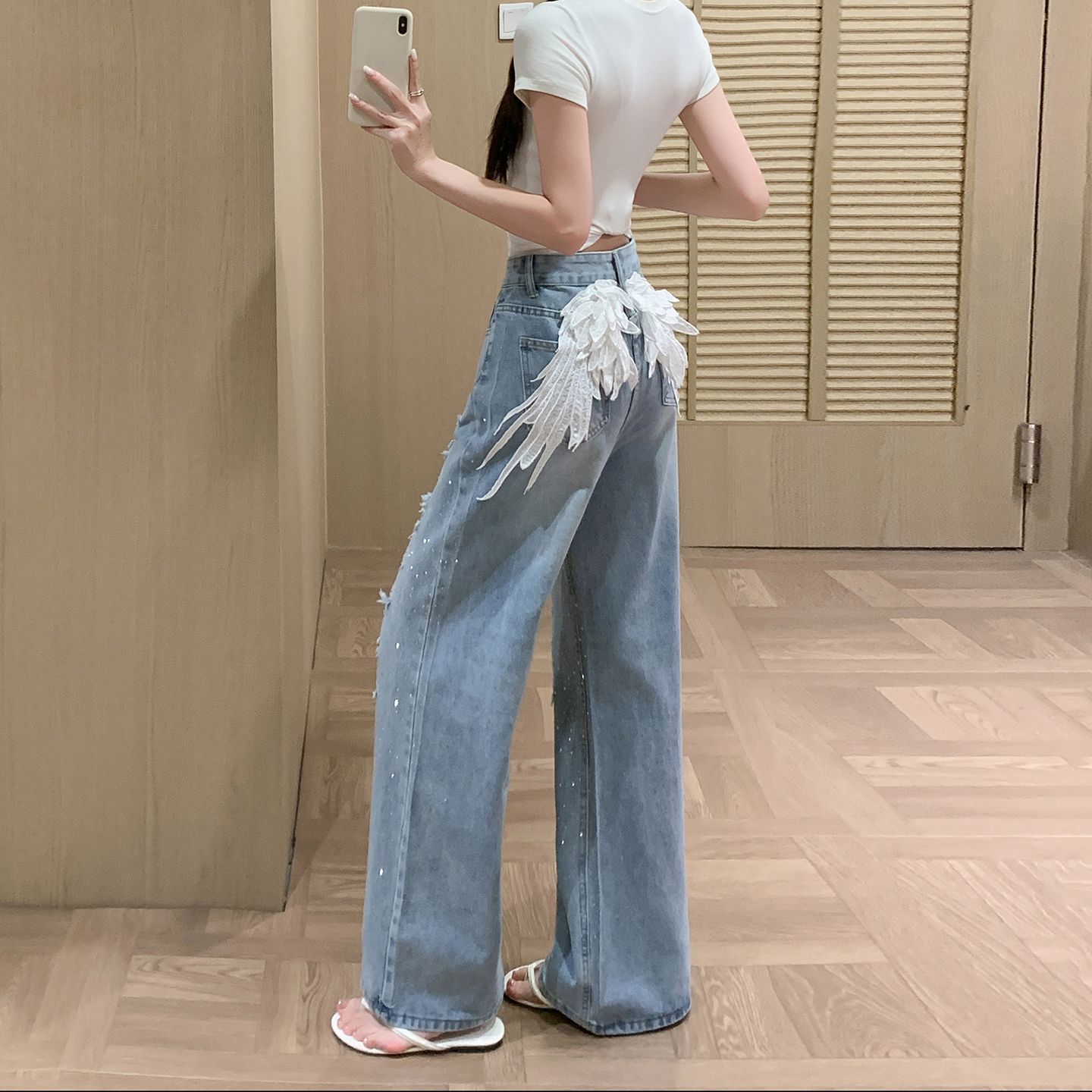 美式辣妹时尚烫钻破洞牛仔裤女秋季新款裤子设计感天使翅膀刺绣裤