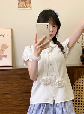 奶油的宇宙 设计感花朵绑带娃娃领衬衫短袖女甜美白色泡泡袖上衣