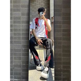 韩版大码胖子斜杠条纹红黑撞色拼接直筒裤小众设计帅气黑色牛仔裤