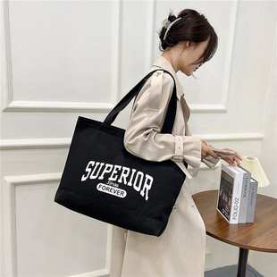 2021原创字母超大号包单肩包包书包文艺简约复古大容量旅行帆布包