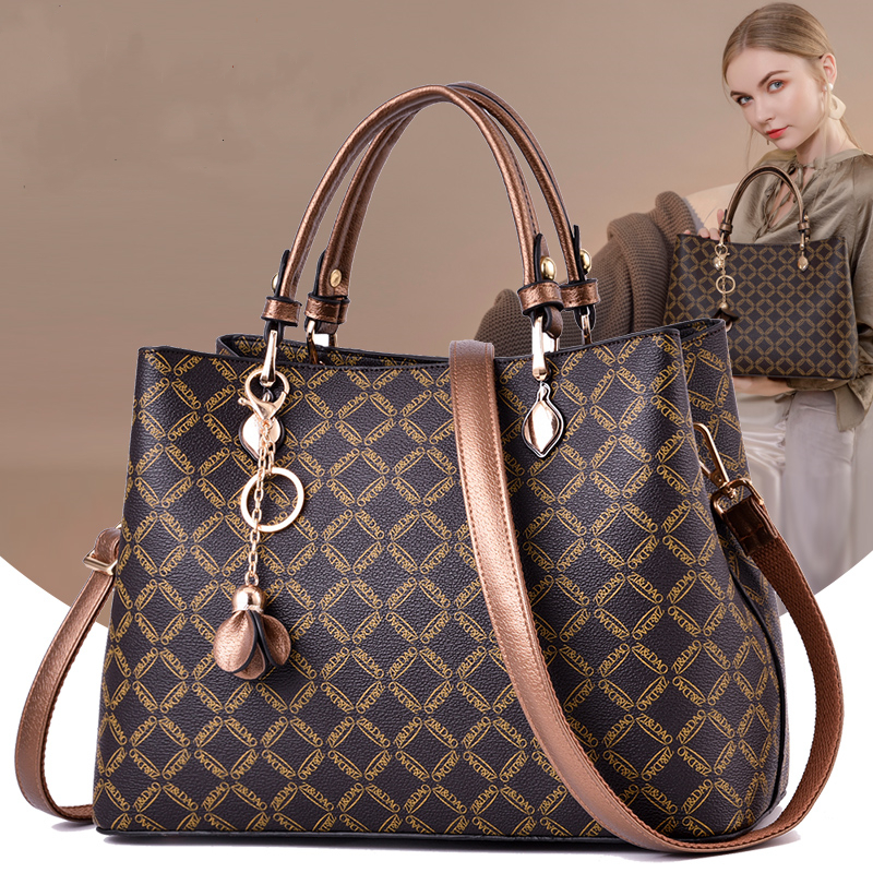 バッグはお母さんの中年の2021新型のファッションの大気の50歳の40大容量の真皮の秋冬の女性のハンドバッグを送ります
