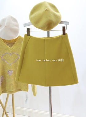 韩国高级半身裙2025冬设计感立体裁剪姜黄色拼接毛呢加厚A版短裙