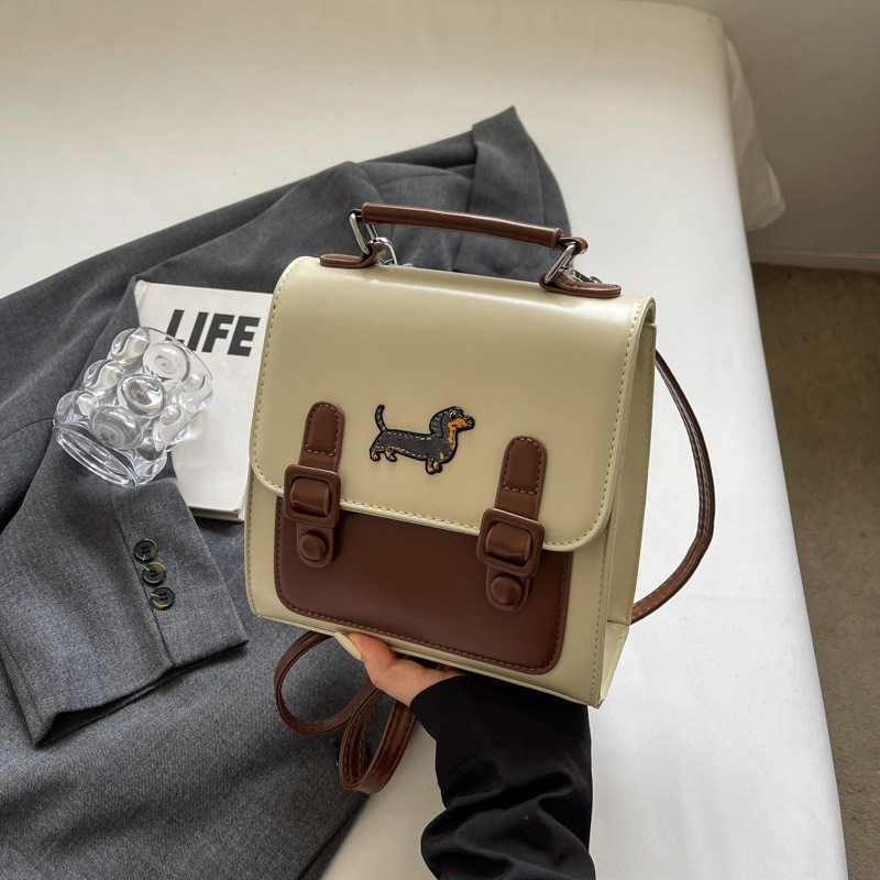 儿童包包可爱斜挎包2026新款休闲洋气百搭小狗图案手提外出双肩包