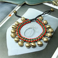 Большой браслет-колокольчик из плетеной веревки красного, темно-зеленого цвета.