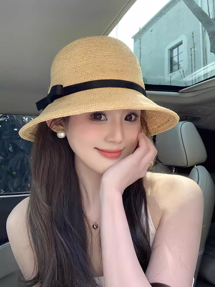 夏季新款进口拉菲草渔夫草帽子女轻奢真丝麻赫本礼帽防晒度假盆帽