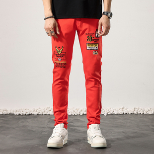 夏季刺绣牛仔裤男款弹力修身小脚潮牌高端欧货橘红色男士休闲长裤
