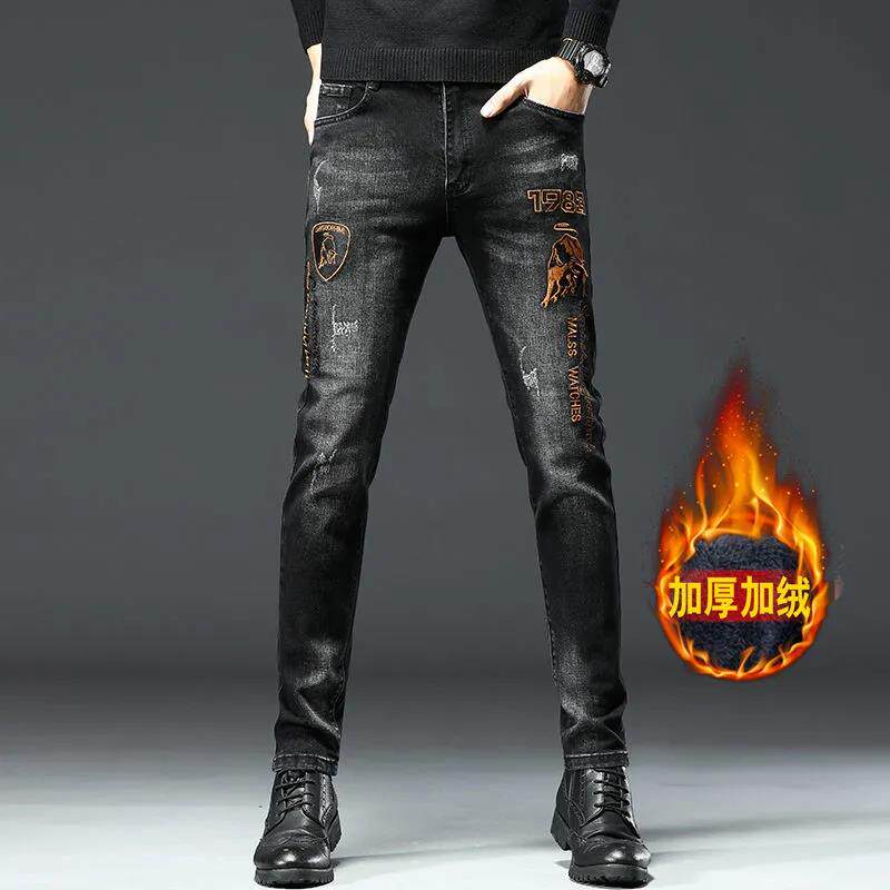 高端金牛刺绣加绒加厚牛仔裤男款潮牌黑色修身小脚休闲保暖长裤子