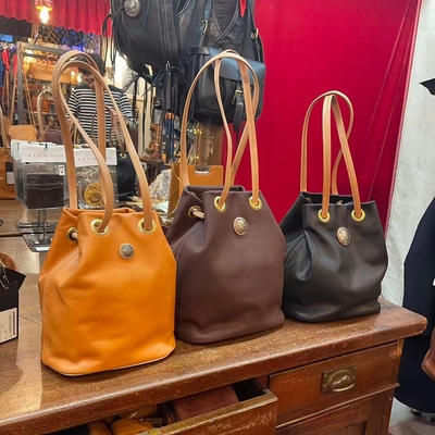 真皮新款休闲男包女包手提包