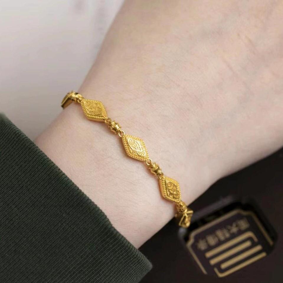 周大福鱼化龙足金黄金菱形手链图片