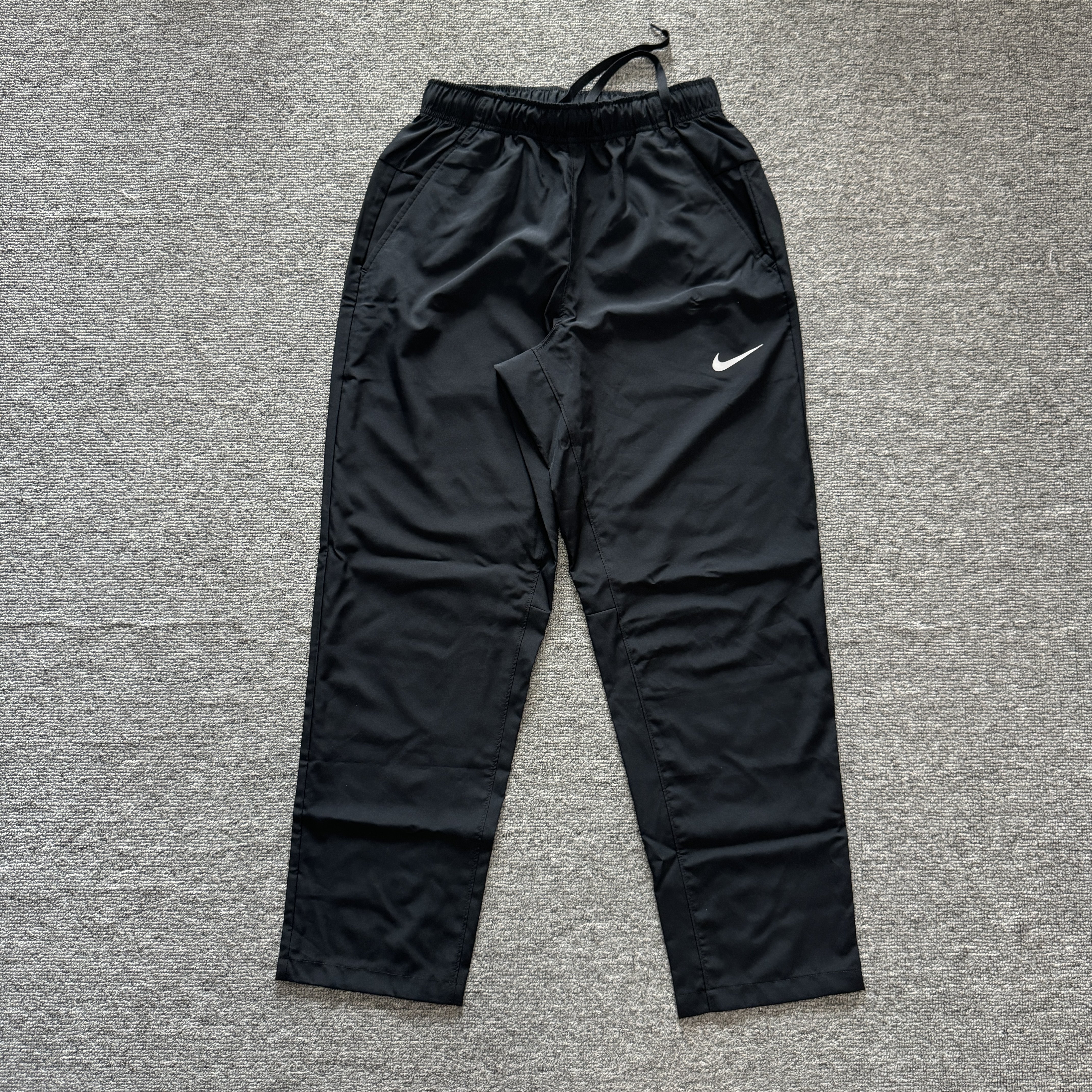 Nike/耐克 男子梭织跑步训练速干透气直筒休闲运动长裤FB7491-010