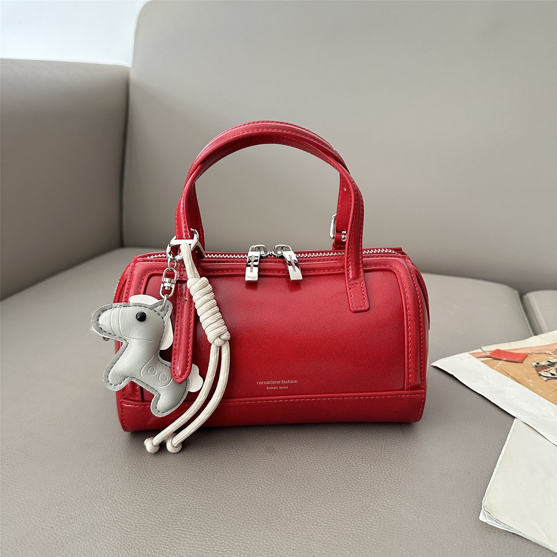 红色枕头包女2026新款质感精致手提波士顿包时尚复古时髦轻奢小包