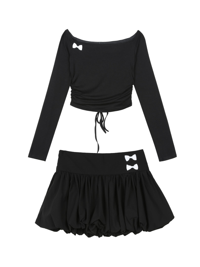 Black two-piece outfit set with a long-sleeve crop top and mini skirt with bow details