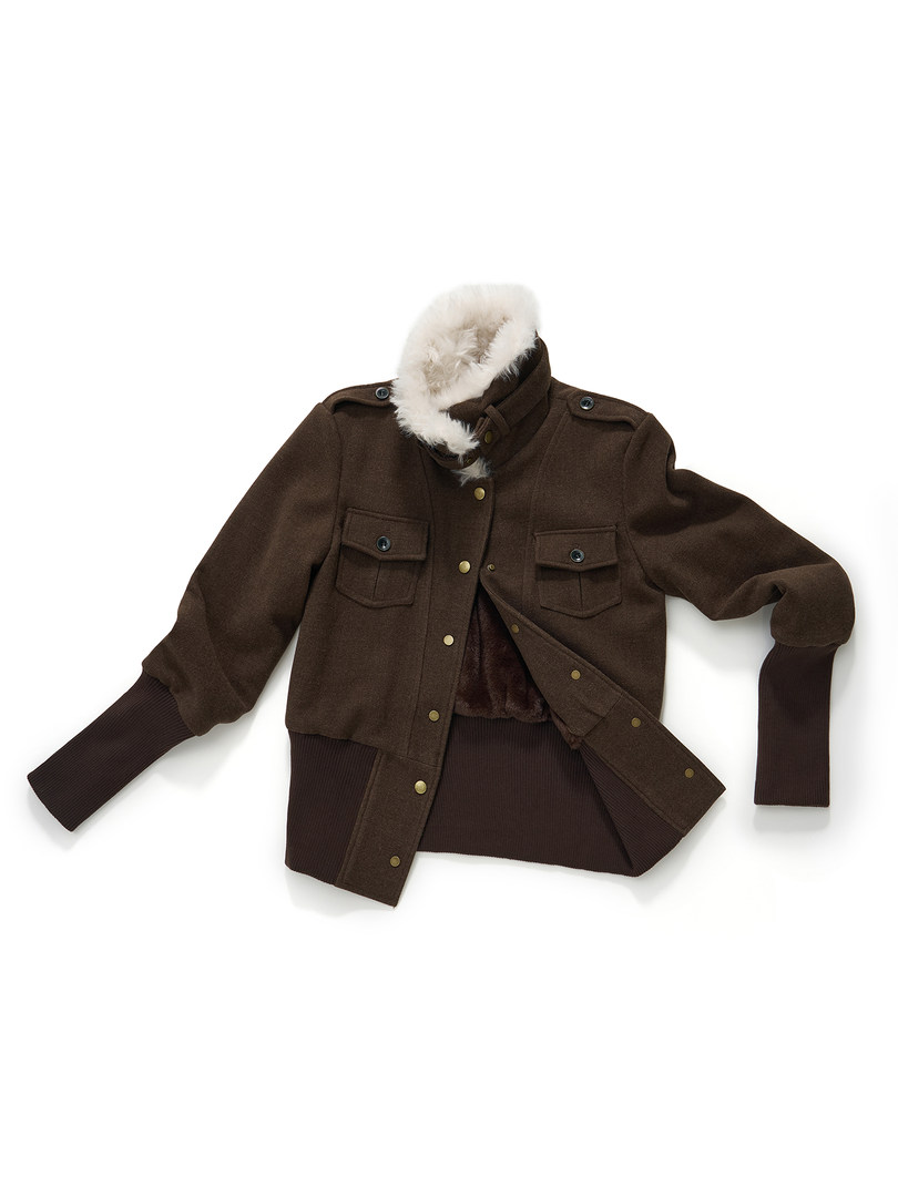 Brown winter jacket with fur collar laid flat on a white background