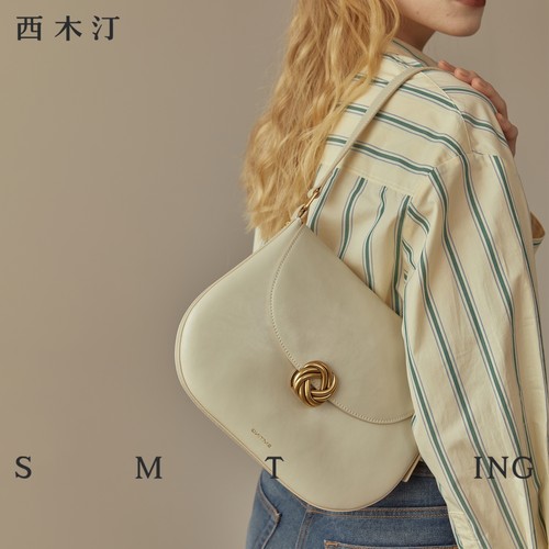 西木汀牛皮百搭单肩斜挎马鞍包