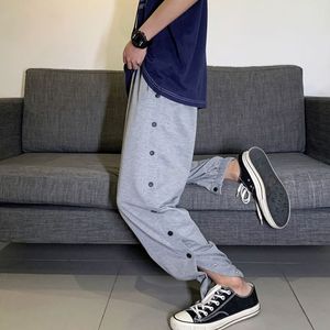 篮球训练全开扣裤束脚欧文运动排扣出场长裤热身侧开纽扣9分裤图片